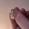 1 1/4 pear shaped diamond ring with 4 smaller diamonds on each side  offer Jewelries