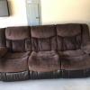 Dual recliner sofa very good condition; 14 months old offer Garage and Moving Sale