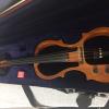 Gently used Oak frame Full size Electric Violin 4/4 by Carlo Robelli. Includes chin rest, amplifier cord, and case. Grea