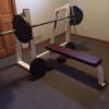 $50 Olympic weight bench, bar and weights
