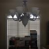 Entertainment Center, ceiling lamps and a chair