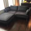 A 6 months old, grey sofa with ottoman in great conditon