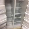 Whirlpool Side by Side Refrigerator, Off White with Ice and water in the door. $150.00