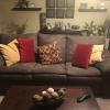 Olive green couch and love seat, end table and dark green rocker/recliner