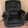 Olive green couch and love seat, end table and dark green rocker/recliner