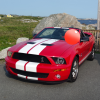 2009 Ford Shelby GT500 Mustang Convertible. Red with white racing stripes. 5.4L 630 hp.