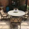 Five piece Tropitone outdoor table and four chairs