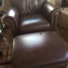 2 LARGE LEATHER CHAIRS AND OTTOMAN