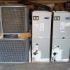Two central heat and air conditioning units