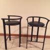 2 black leather seat bar stools + working black large screen TV offer Home and Furnitures