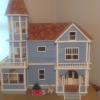 large wooden Victorian dollhouse