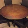 46” round Copper Top Table and 4 leather looking tuxedo chairs