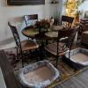 like new round dining room table and 4 chairs