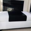 Black and White Italian Leather Ottoman with storage space in the centre. offer Home and Furnitures