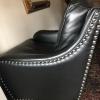 2 black leather chairs