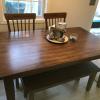 Kitchen table with 4 cushioned chairs and bench