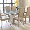 glass top table with four matching chairs