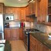 Kitchen cabinets, gas range, s/s sink, hood fan