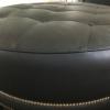 Ethan Allen Black leather ottoman with brass grommets