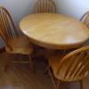 Oak table with butterfly leaf located under table all connected...4 matching chairs