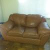 Leather love seat and chair and wooden table