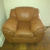 Leather love seat and chair and wooden table
