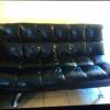 Blk futon sofa bed and recliner with USB port storage on armrest