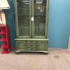 Green with gold hutch. Cabinet, glass shelves. $75