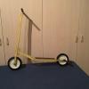 Antique yellow scooter with kickstand 