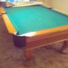 8 foot pool table with leather cover, balls and sticks