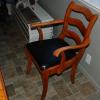 5 hardwood dining chairs. 1 captain's chair and 4 regular chairs