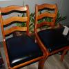 5 hardwood dining chairs. 1 captain's chair and 4 regular chairs