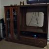 Wooden entertainment center with glass cabinet  offer Home and Furnitures
