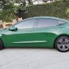 2021 Tesla Model 3 Standard Range Plus, finished in Pearl White Multi-Coat with an Avery Dark Green exterior wrap and a 