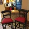 2 dark wood bar stools offer Home and Furnitures