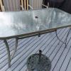 metal table with glass top and stand and 6 chairs